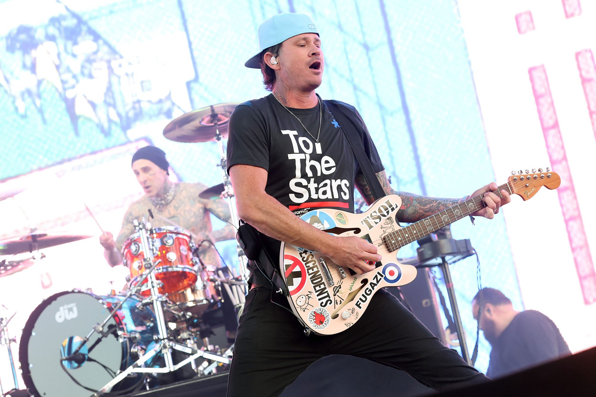 INDIO, CALIFORNIA - APRIL 14: (L-R) Travis Barker and Tom DeLonge of Blink-182 performs at the Sahara Tent during the 2023 Coachella Valley Music and Arts Festival on April 14, 2023 in Indio, California. (Photo by Monica Schipper/Getty Images for Coachella)